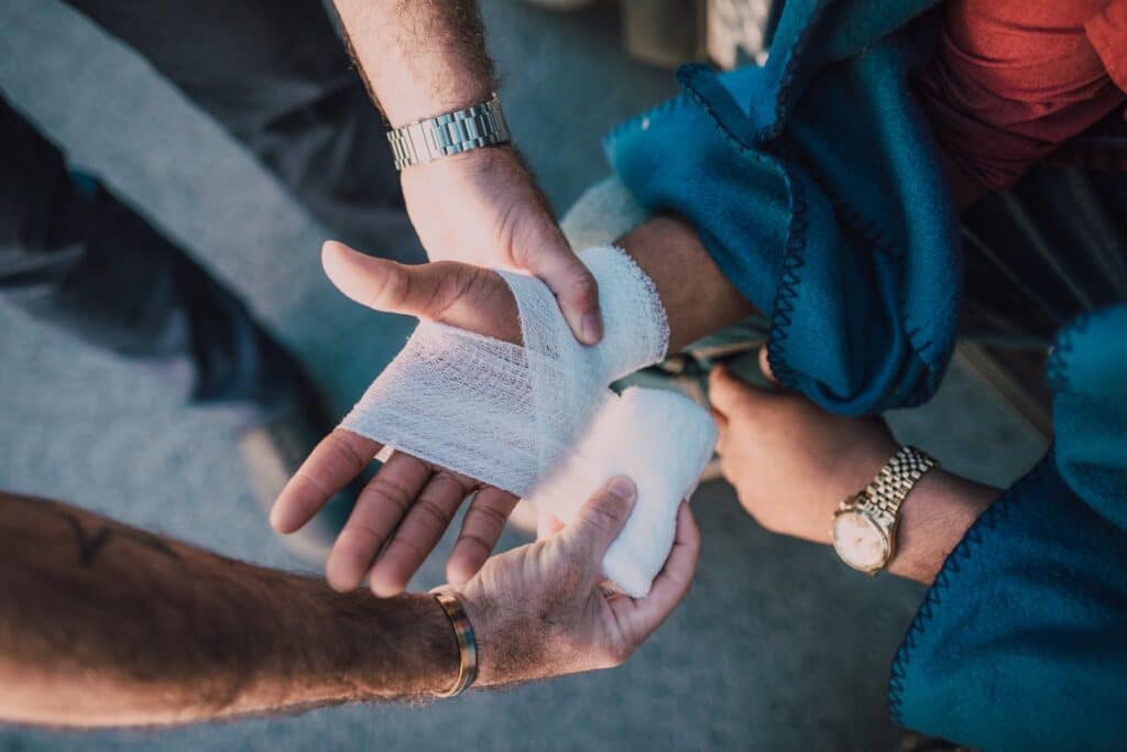 Close-up of a person receiving a hand bandage after car accidents in Murfreesboro.