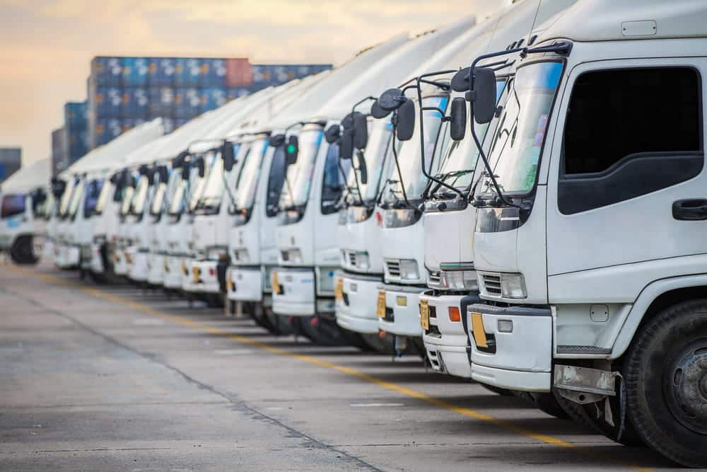 Can You Sue a Trucking Company After a Crash Commercial Truck Fleet Yard